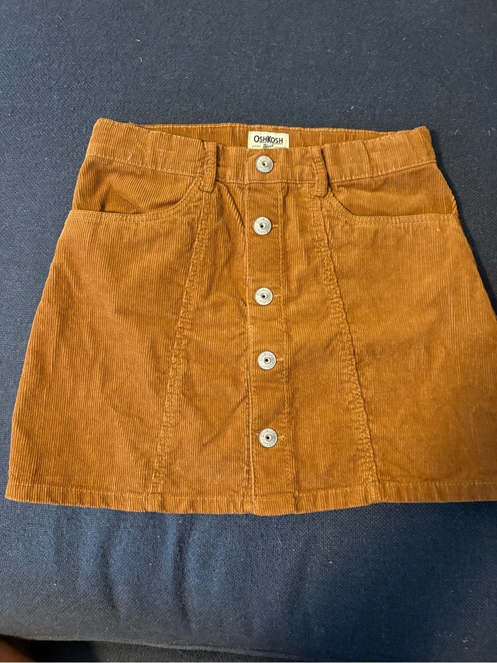 EUC OSHKOSH Corduroy skirt. Girls size 10. Snap front with pockets. Elastic band
